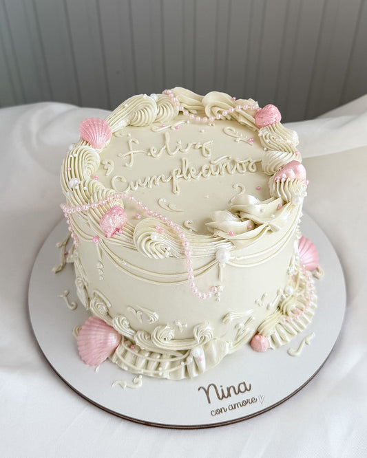 SEA CAKE BLANCA CON DETALLES ROSADOS